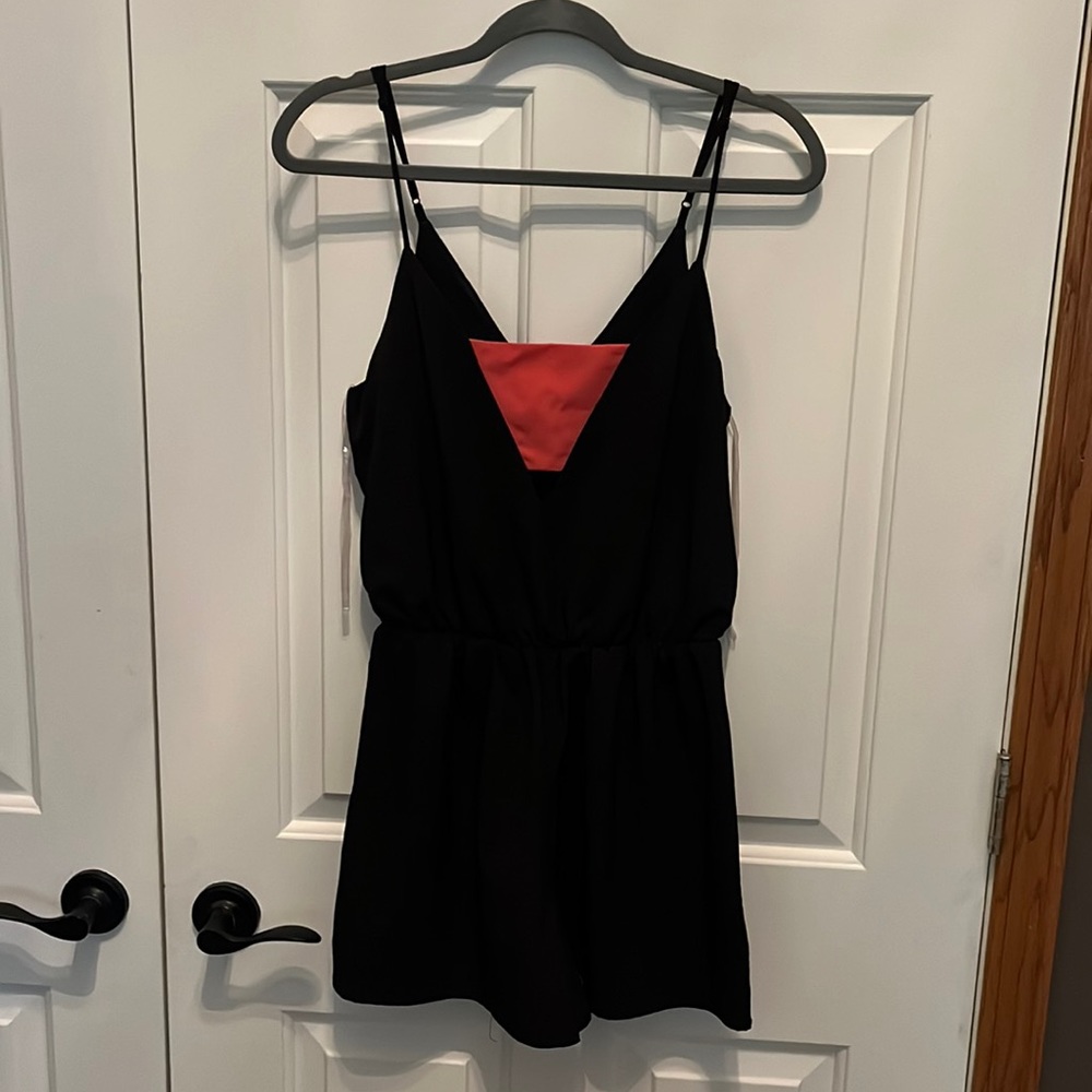 Black romper with pink band detail